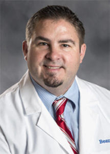 Shown here in a headshot, Dr. Joseph Guettler is an orthopedic surgeon at UnaSource Surgery Center in Troy, Michigan.