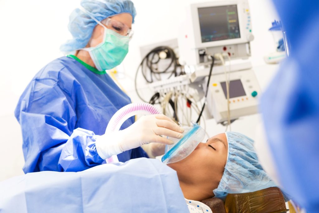 An anesthesiologist assists a patient. There are four main types of anesthesia that are most commonly used.